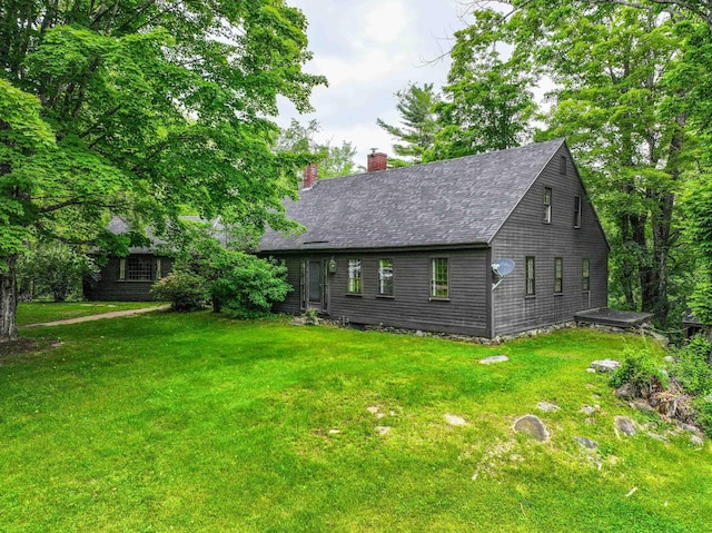 1448 Bound Tree Rd, Hopkinton, NH 03229 - view of front facade featuring a chimney, a front yard, and roof with shingles