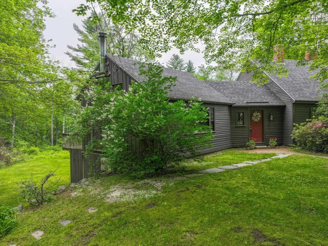 1448 Bound Tree Rd, Hopkinton, NH 03229 - view of front of house featuring roof with shingles, a front lawn, and a chimney