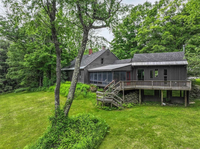 1448 Bound Tree Rd, Hopkinton, NH 03229 - rear view of house with a sunroom, roof with shingles, a lawn, a wooden deck, and stairs