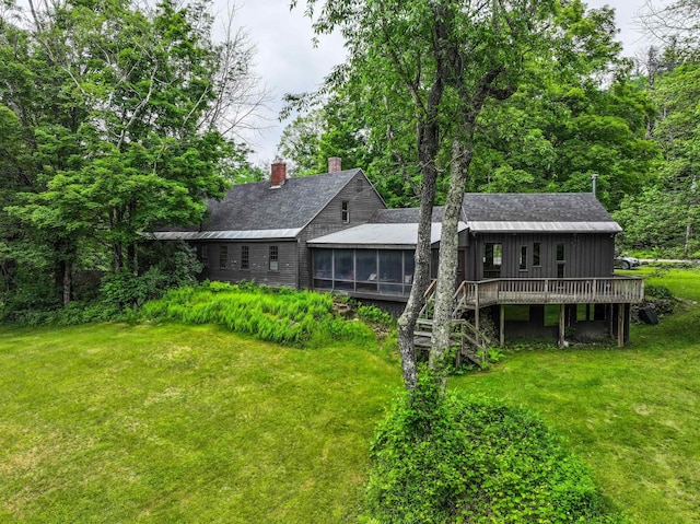 1448 Bound Tree Rd, Hopkinton, NH 03229 - back of property featuring a sunroom, a yard, a wooden deck, and a chimney