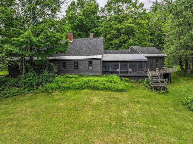 1448 Bound Tree Rd, Hopkinton, NH 03229 - back of house with a sunroom, a lawn, a chimney, a deck, and stairway