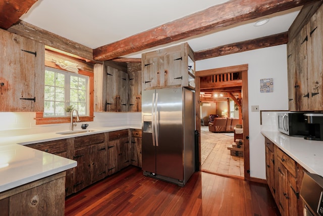 1448 Bound Tree Rd, Hopkinton, NH 03229 - kitchen featuring appliances with stainless steel finishes, beam ceiling, dark wood-style floors, light countertops, and backsplash