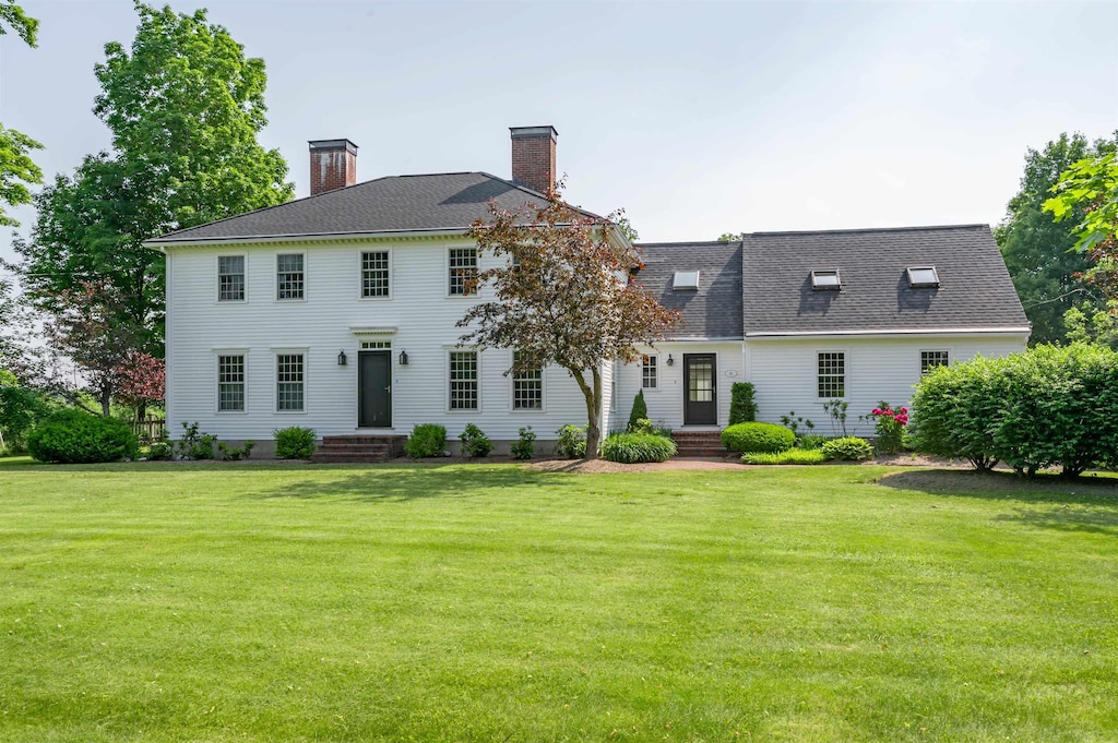 16 Depot Rd, Hollis, NH 03049 - back of property with a chimney and a yard