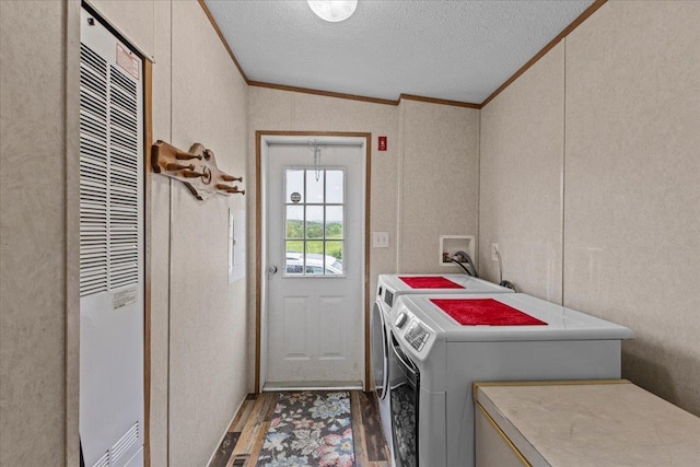 908 Gilbert Rd, Williamstown, VT 05679 - laundry room with crown molding, washer and dryer, a heating unit, a textured ceiling, and wood finished floors