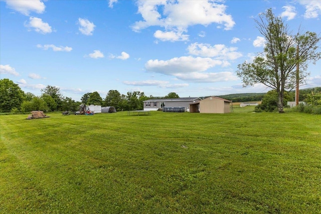 908 Gilbert Rd, Williamstown, VT 05679 - view of grassy yard with an outdoor structure