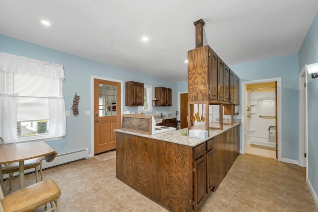 906 N Main St, Laconia, NH 03246 - kitchen with a peninsula, light tile patterned floors, and recessed lighting