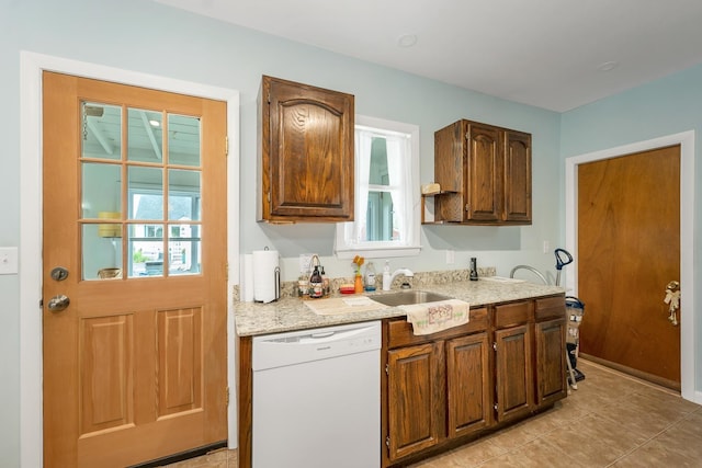 906 N Main St, Laconia, NH 03246 - kitchen featuring dishwasher, light countertops, plenty of natural light, and light tile patterned floors