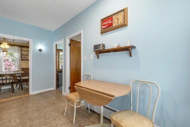 906 N Main St, Laconia, NH 03246 - dining room with plenty of natural light and light tile patterned flooring