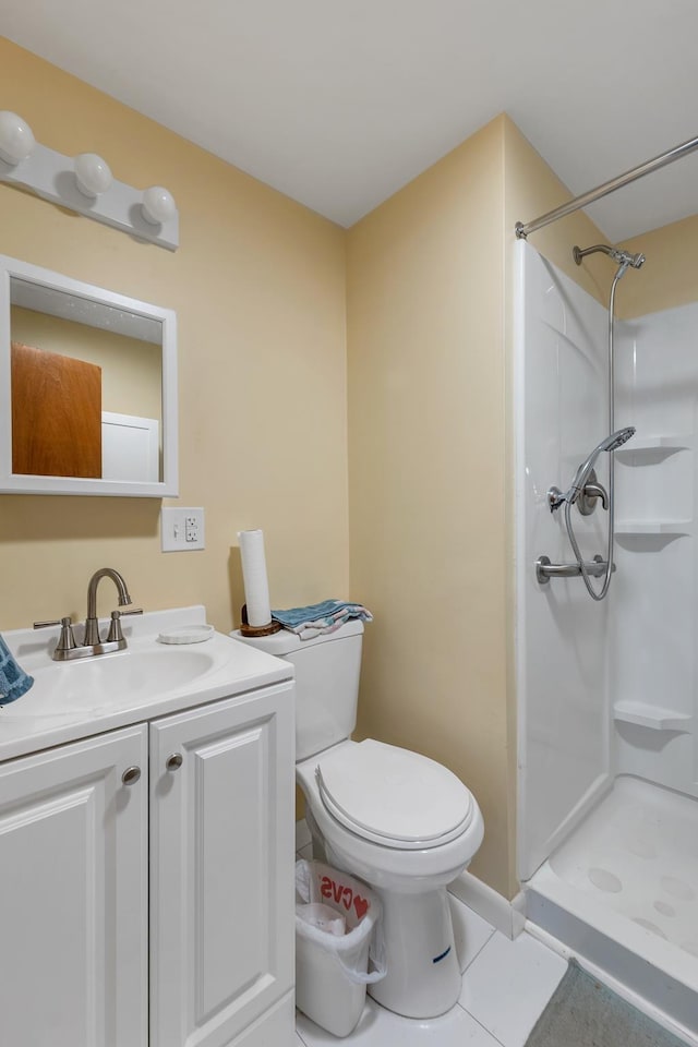 906 N Main St, Laconia, NH 03246 - bathroom featuring a stall shower, tile patterned floors, and vanity