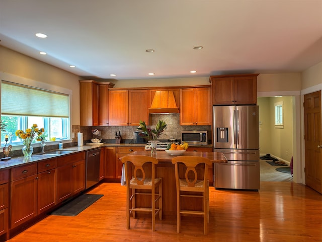2 Parker Farm Ln, Amherst, NH 03031 - kitchen featuring stainless steel appliances, premium range hood, decorative backsplash, a kitchen island, and recessed lighting