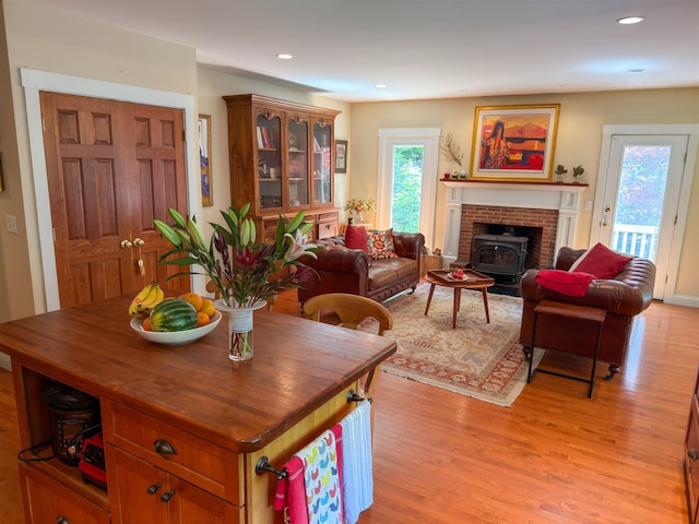 2 Parker Farm Ln, Amherst, NH 03031 - dining area featuring a wood stove, light wood finished floors, and recessed lighting