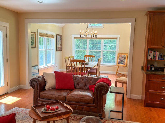 2 Parker Farm Ln, Amherst, NH 03031 - living area with a chandelier and light wood-style floors