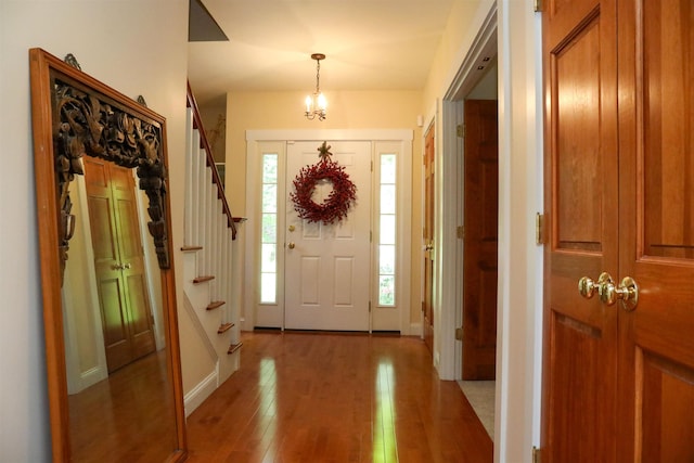 2 Parker Farm Ln, Amherst, NH 03031 - foyer entrance with light wood finished floors and stairs