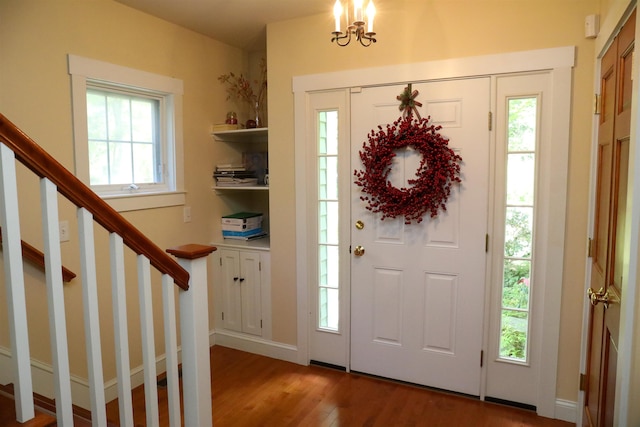 2 Parker Farm Ln, Amherst, NH 03031 - entryway featuring wood finished floors, stairway, and a chandelier