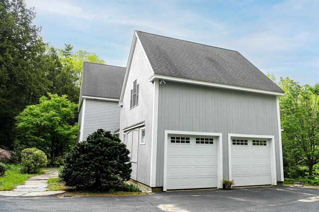 2 Parker Farm Ln, Amherst, NH 03031 - view of side of home with a shingled roof