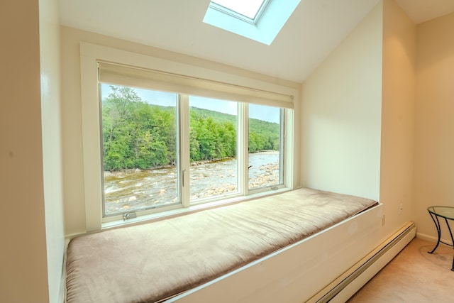58 Bunker Ln Unit 3, Lincoln, NH 03251 - unfurnished bedroom with a skylight, light carpet, vaulted ceiling, and a baseboard heating unit