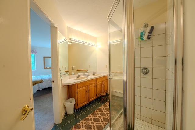 58 Bunker Ln Unit 3, Lincoln, NH 03251 - bathroom with double vanity, tile patterned floors, a stall shower, and ensuite bathroom