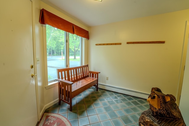 58 Bunker Ln Unit 3, Lincoln, NH 03251 - living area featuring baseboard heating and dark tile patterned flooring