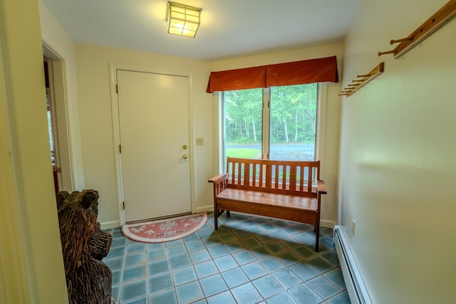 58 Bunker Ln Unit 3, Lincoln, NH 03251 - tiled foyer entrance with a baseboard radiator and baseboards