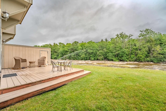 58 Bunker Ln Unit 3, Lincoln, NH 03251 - view of green lawn featuring a wooden deck and a forest view