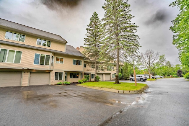 58 Bunker Ln Unit 3, Lincoln, NH 03251 - view of front of home with a garage and asphalt driveway