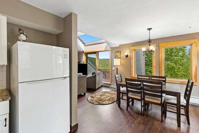 105 Timberline Rd S Unit L8, Killington, VT 05751 - dining room with dark wood-type flooring, healthy amount of natural light, and a chandelier