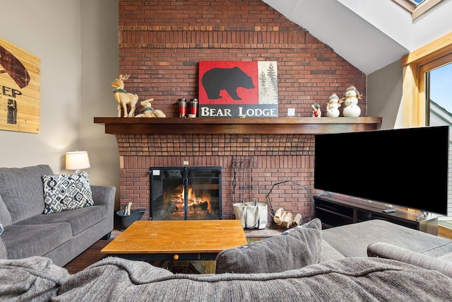 105 Timberline Rd S Unit L8, Killington, VT 05751 - living area with lofted ceiling, wood finished floors, a fireplace, and brick wall