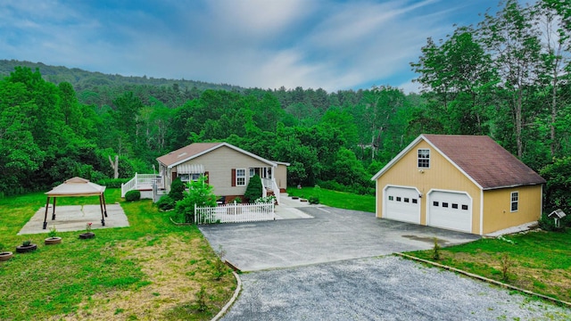 2459 US Route 7, Leicester, VT 05733 - view of front of home featuring a view of trees, an outdoor structure, a garage, a gazebo, and a front yard