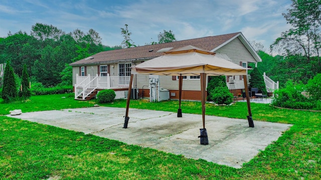 2459 US Route 7, Leicester, VT 05733 - rear view of house with a patio area, a yard, a storage shed, a gazebo, and a wooden deck