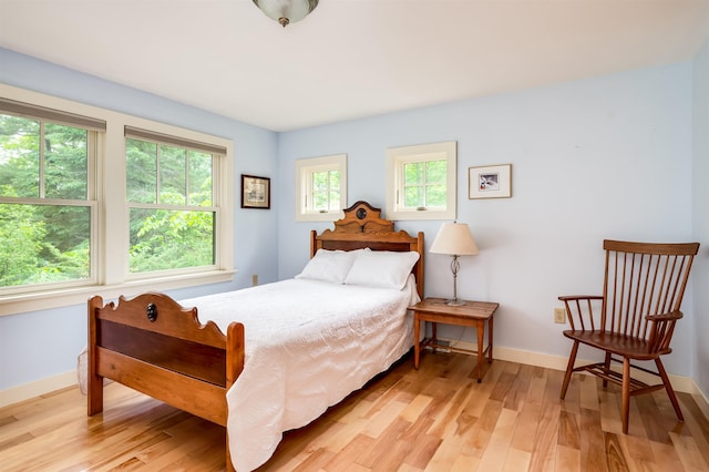 30 Old Piscataqua Rd, Durham, NH 03824 - bedroom with light wood-style floors and baseboards