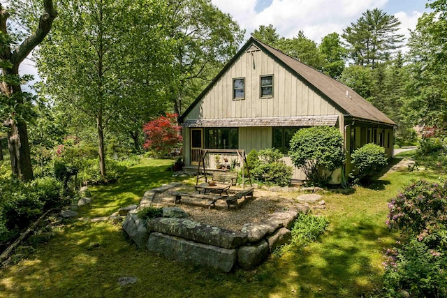 30 Old Piscataqua Rd, Durham, NH 03824 - rear view of property featuring a lawn and an outdoor fire pit