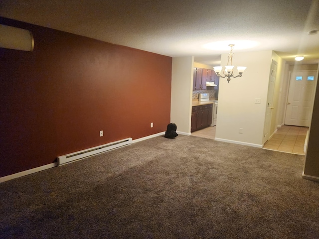 17 Burns Ave Unit 2, Concord, NH 03301 - unfurnished living room featuring a baseboard radiator, a chandelier, and light carpet