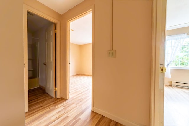 30 Beech St Unit 4B, Bristol, NH 03222 - corridor featuring light wood finished floors and baseboard heating