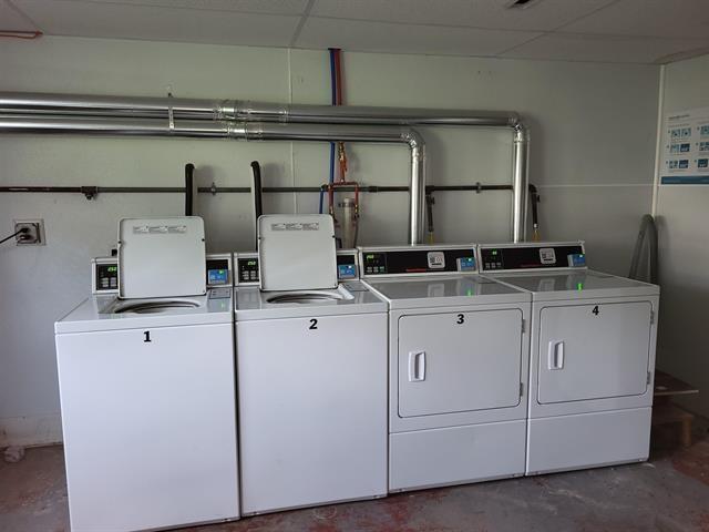 30 Beech St Unit 4B, Bristol, NH 03222 - community laundry room featuring washer and clothes dryer