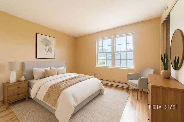 30 Beech St Unit 4B, Bristol, NH 03222 - bedroom featuring a baseboard radiator, light wood-style floors, and a closet