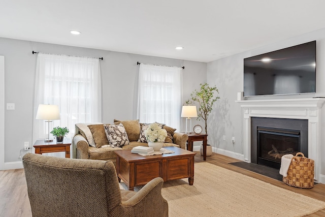 7A Terraceview Dr, Hudson, NH 03051 - living room featuring light wood-style flooring, recessed lighting, and a fireplace with flush hearth