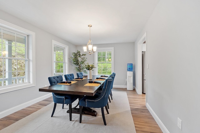 7A Terraceview Dr, Hudson, NH 03051 - dining space featuring a chandelier and light wood-type flooring