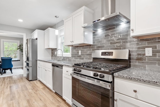 7A Terraceview Dr, Hudson, NH 03051 - kitchen with stainless steel appliances, wall chimney exhaust hood, light stone counters, white cabinetry, and recessed lighting
