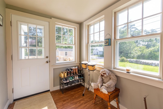 83 Tamworth Rd, Tamworth, NH 03886 - doorway to outside with wood finished floors and baseboards