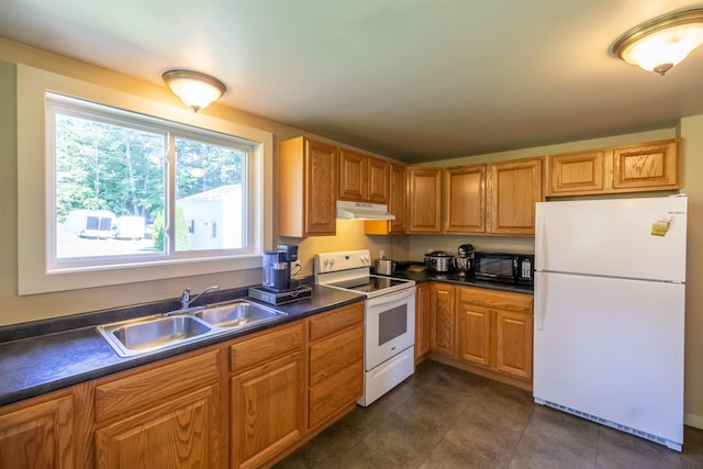 83 Tamworth Rd, Tamworth, NH 03886 - kitchen featuring white appliances, under cabinet range hood, dark countertops, and dark tile patterned floors