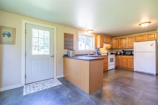83 Tamworth Rd, Tamworth, NH 03886 - kitchen featuring white appliances, under cabinet range hood, dark countertops, and a peninsula