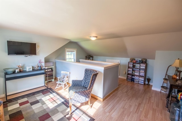 83 Tamworth Rd, Tamworth, NH 03886 - living area featuring light wood-style flooring, lofted ceiling, and an upstairs landing