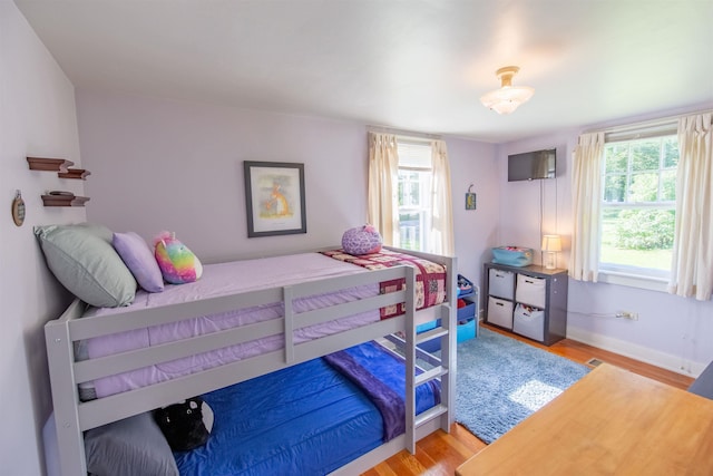 83 Tamworth Rd, Tamworth, NH 03886 - bedroom with light wood-style flooring and multiple windows