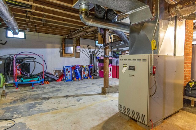 83 Tamworth Rd, Tamworth, NH 03886 - unfinished below grade area featuring heating unit and electric panel