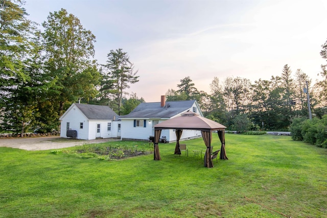83 Tamworth Rd, Tamworth, NH 03886 - back of property featuring a gazebo, a chimney, and a lawn
