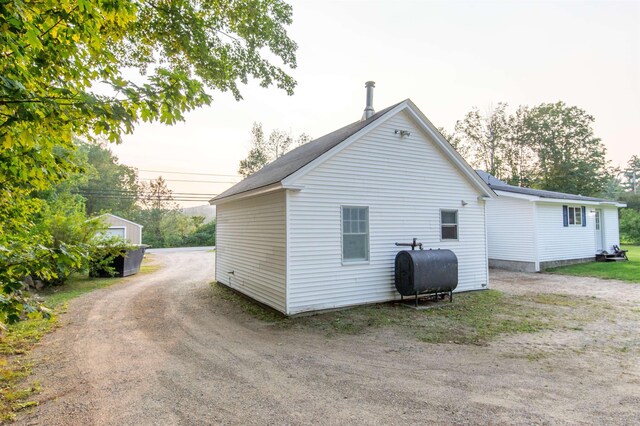 83 Tamworth Rd, Tamworth, NH 03886 - view of side of home featuring heating fuel