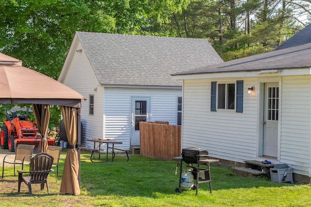 83 Tamworth Rd, Tamworth, NH 03886 - rear view of property featuring a shingled roof, a gazebo, and a yard