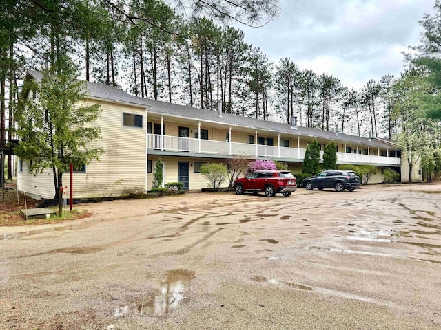 42 Wylie Ct Unit 6, Conway, NH 03860 - view of building exterior featuring uncovered parking