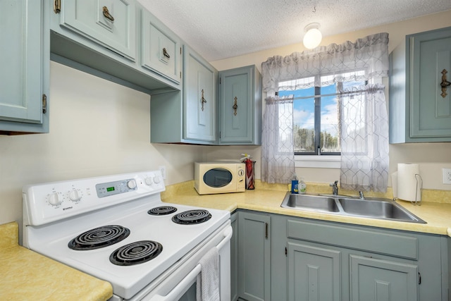 42 Wylie Ct Unit 6, Conway, NH 03860 - kitchen featuring white appliances, light countertops, and a textured ceiling