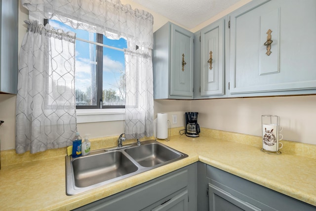 42 Wylie Ct Unit 6, Conway, NH 03860 - kitchen with light countertops, gray cabinets, plenty of natural light, and a textured ceiling
